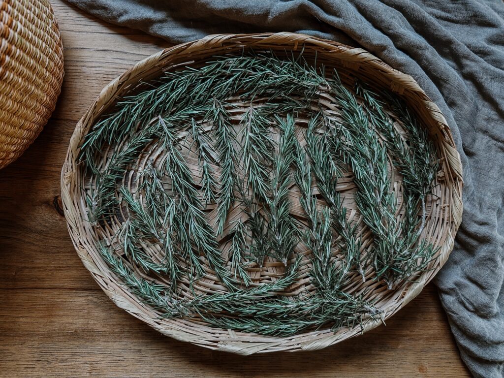 rosemary in a basket with linen cloth