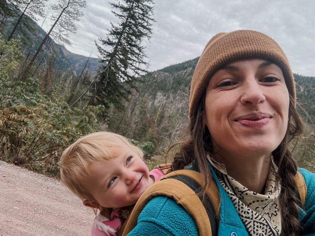 Mother and daughter watching papa harvest elderberry